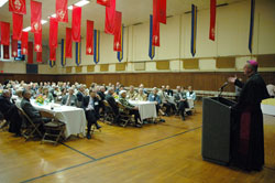 Bishop Christopher J. Coyne, right, auxiliary bishop and vicar general, speaks to members of the archdiocese&rsquo;s Miter Society on May 4 at the Archbishop O&rsquo;Meara Catholic Center in Indianapolis. (Photos by Sean Gallagher)