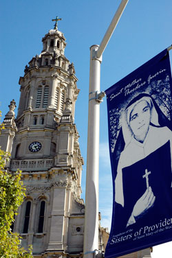 A banner of St. Theodora Gu&eacute;rin is displayed outside the Church of the Immaculate Conception at Saint Mary-of-the-Woods. She was canonized on Oct. 15, 2006, by Pope Benedict XVI. (File photo by Mary Ann Wyand)