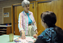 Benedictine Sister Carol Falkner, administrator of the Benedict Inn Retreat and Conference Center in Beech Grove, discusses a future art program with Dema Newby, marketing coordinator, on May 18 in the center&rsquo;s art room. The staff focuses on creating spiritual retreats that are interesting, helpful, fun, relaxing and energizing experiences. (Photo by Mary Ann Wyand)
