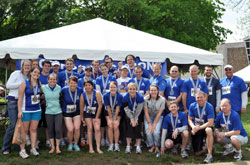 Members of the &ldquo;Race for Vocations&rdquo; team pose on May 7 by the team&rsquo;s tent at Military Park in Indianapolis after completing the OneAmerica 500 Festival Mini-Marathon or the Finish Line 500 Festival 5K. (Submitted photo)
