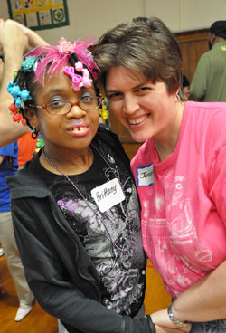 Brittany Belton, left, and Jennifer Toler, both of Indianapolis, pose for a photograph during the &ldquo;Special Night Out&rdquo; party on June 7 at the Archbishop O&rsquo;Meara Catholic Center in Indianapolis. (Photo by Mary Ann Wyand)