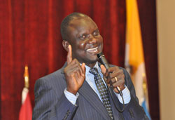 Human rights activist John Dau, now a resident of Syracuse, N.Y., talks about his fundraising efforts to help provide medical care for thousands of people in southern Sudan. He is a former &ldquo;Lost Boy of Sudan&rdquo; who survived countless threats to his life during a civil war that started in 1983. (Photo by Mary Ann Wyand)