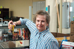 Sheila Gilbert recently became the first woman elected president of the national council of the U.S. Society of St. Vincent de Paul. Here, she poses for a photo at the society&rsquo;s Client Choice Food Pantry in Indianapolis, where she greets hundreds of people in need every Tuesday morning. (Photo by John Shaughnessy)