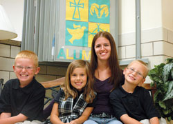 Megan Ward says that Indiana&rsquo;s school voucher system has created new educational hopes and possibilities for her three school-aged children, who now attend Holy Spirit School in Indianapolis. Her children are Matthew, left, Amiya and Olan. (Photo by John Shaughnessy)