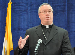 Bishop Christopher J. Coyne speaks during the Sept. 21 press conference announcing Archbishop Daniel M. Buechlein&rsquo;s retirement from active ministry. Pope Benedict XVI appointed Bishop Coyne the archdiocese&rsquo;s apostolic administrator. (Photo by Mary Ann Garber)