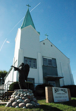 Since 1903, Holy Angels Church has been a beacon of hope and faith in its Indianapolis neighborhood. Because of structural problems and health concerns, the church will be closed after the parish&rsquo;s annual fall revival ends on Oct. 11. The parish hopes to eventually build a new church on the same hilltop site. (Photo by John Shaughnessy)