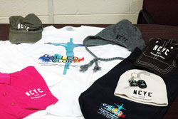 T-shirts, polo shirts, hooded sweatshirts, several varieties of hats, dog tags and key chains are among the many items being sold for the National Catholic Youth Conference being held on Nov. 17-19 in Indianapolis. Souvenir items are available through the conference&rsquo;s website at www.ncyc.nfcym.org. Click on &ldquo;NCYC Gear&rdquo; at the top of the website&rsquo;s first page to shop for souvenirs. (Photo by John Shaughnessy)