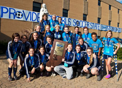 Members of the girls&rsquo; soccer team at Our Lady of Providence Jr./Sr. High School in Clarksville show their joy&nbsp;and their trophy after winning the Class A state championship on Oct. 29. It is the first time in the 60-year history of the school that a Providence team has won an Indiana High School Athletic Association state championship in a team sport. (Submitted photo)