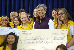 Benedictine Sister Mary Nicolette Etienne smiles with joy after her eighth-grade religion students at Holy Name of Jesus School in Beech Grove surprised her on Dec. 7 with a trip to Lourdes, France&mdash;the dream trip she has wanted to take ever since she heard the story of the promise that her mother made to God there as a young woman. (Photo by John Shaughnessy)