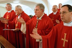 U.S. bishops on their ad limina visits concelebrate Mass in front of the tomb of St. Peter in the crypt of St. Peter&rsquo;s Basilica at the Vatican on Feb. 9. From left in the first row are Bishop Christopher J. Coyne of Indianapolis; Retired Bishop Gerald A. Gettelfinger of Evansville, Ind.; Archbishop Jerome E. Listecki of Milwaukee; and Bishop Charles C. Thompson of Evansville, Ind. (CNS photo/Paul Haring)