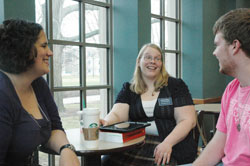 As a chaplain&rsquo;s apprentice to Father Jeffrey Godecker at Butler University in Indianapolis, Kaitlyn Willy, center, always looks for different ways to connect with the college&rsquo;s Catholic students. Here, she shares a laugh with Meggie Gallina, a member of St. Elizabeth Ann Seton Parish in Carmel, Ind., in the Lafayette Diocese, and Steven Meuleman, a member of St. Lawrence Parish in Indianapolis. (Photo by John Shaughnessy)