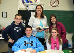 Five teachers from across the archdiocese were recently recognized as winners of the Saint Theodora Excellence in Education Award. Lisa Vogel, above, the eighth-grade teacher at St. Mary School in North Vernon, says her main focus when teaching students is to be a Christian by the love that she shows others. She is pictured with students, seated, from left, Trace&nbsp;Sporleder and Taylor AmRhein. Standing are Kobe Eder, Vogel and Stefani Williams. (Submitted photo)