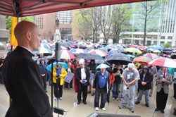 Father John Hollowell, left, chaplain of Cardinal Ritter Jr./Sr. High School in Indianapolis and associate pastor of St. Malachy Parish in Brownsburg, speaks on March 23 during the &ldquo;Stand Up for Religious Freedom&rdquo; rally on the grounds of the Indiana Statehouse in Indianapolis. (Photo by Sean Gallagher)