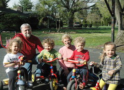 Married for 42 years, Fred and Doris Chandler have experienced an unexpected blessing in their spiritual lives by helping to care for four children&mdash;a set of triplets that were born seven weeks prematurely and their baby brother. The Chandlers are pictured with Addy, left, Drew, Alex and Clara, the children of Aaron and Maribeth Smith. (Photo by John Shaughnessy)