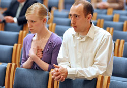 Tom and Caitlin Landrigan, members of Our Lady of the Most&nbsp;Holy Rosary Parish in Indianapolis, kneel in prayer during the annual Miter Society Mass on May 2 at SS. Peter and Paul Cathedral in Indianapolis. The society&rsquo;s membership is made up of Catholics in central and southern Indiana who have contributed at least $1,500 to the &ldquo;Christ Our Hope: Compassion in Community&rdquo; annual appeal. (Photos by Sean Gallagher)