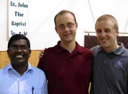 Seminarians Xavier Raj, from left, Michael Keucher and Kyle Rodden pose for a photo at St. John the Baptist Parish in Starlight on Aug. 15 during the annual archdiocesan seminarian pilgrimage. All three seminarians receive their priestly formation at Saint Meinrad Seminary and School of Theology in St. Meinrad. Raj is a member of St. Jude Parish in Indianapolis. Keucher is a member of St. Charles Borromeo Parish in Bloomington. Rodden is a member of Most Sacred Heart of Jesus Parish in Jeffersonville. (Submitted photo)