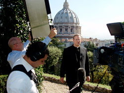 Father Robert Barron stands on a hilltop overlooking St. Peter&rsquo;s Basilica in Rome during the shooting of his 10-part documentary series &ldquo;Catholicism.&rdquo; A priest of the Archdiocese of Chicago, Father Barron is the founder and president of Word on Fire Ministries and rector of the University of St. Mary of the Lake Mundelein Seminary near Chicago. During a recent visit to Indianapolis, Father Barron reflected on the meaning and continued relevance of the Second Vatican Council. The 50th anniversary of the opening of the council, which took place in St. Peter&rsquo;s Basilca, occurred on Oct. 11. (Photo courtesy Word on Fire Ministries)