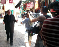 Father Robert Barron walks down a street in Jerusalem during the filming of his 10-part documentary series &ldquo;Catholicism.&rdquo; (Photo courtesy Word on Fire Ministries)