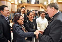 Archbishop Joseph W. Tobin greets Hispanic Catholics after the Oct. 18 press conference at SS. Peter and Paul Cathedral in Indianapolis during which he was introduced as the new archbishop of Indianapolis. Greeting him are, from left, Jes&uacute;s Castillo, a member of St. Anthony Parish in Indianapolis; Gloria Guill&eacute;n, Hispanic ministry assistant for the archdiocesan Office of Multiculture Ministry; Juan Manuel G&uacute;zman, pastoral associate at St. Mary Parish in Indianapolis; Jazmina Noguera, a member of St. Lawrence Parish in Indianapolis; Roberto M&aacute;rquez, pastoral associate at St. Philip Neri Parish in Indianapolis; and Reynaldo N&aacute;va, Hispanic ministry coordinator at Our Lady of the Greenwood Parish in Greenwood. (Photo by Sean Gallagher)