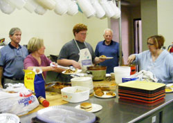 Volunteers in Tell City prepare the weekly dinner they serve to people in need at &ldquo;Table of Blessings,&rdquo; a program of Catholic Charities Tell City that is supported by the &ldquo;United Catholic Appeal: Christ Our Hope.&rdquo; (Submitted photo)