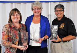 Angels of Grace award recipient Sally Schrock, left, a member of Carmel United Methodist Church in Carmel, Ind., and founder of Second Starts, poses for a photo with award recipients Bonnie Schott of St. Roch Parish in Indianapolis and Indianapolis Metropolitan Police Department Sgt. Jo Ann Moore, a member of Our Lady of the Greenwood Parish in Greenwood, after the fifth annual Benedict Inn Retreat and Conference Center fundraiser on Sept. 29 at Primo Banquet Hall in Indianapolis. The luncheon, style show and awards program were presented by the Sisters of St.&nbsp;Benedict of Our Lady of Grace Monastery in Beech Grove as a way to honor women who help others through distinguished volunteer service that benefits their church and community. (Photo by Mary Ann Garber)