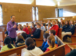 Ken Lolla, head men&rsquo;s soccer coach at the University of Louisville, speaks to fifth-through eighth-grade students at St. Anthony of Padua School in Clarksville about &ldquo;Finding Your Gifts,&rdquo; also the title of his children&rsquo;s book. Earlier, he spoke to second-graders. His talks were part of the school&rsquo;s &ldquo;Step by Step Stewardship&rdquo; program. (Submitted photo)