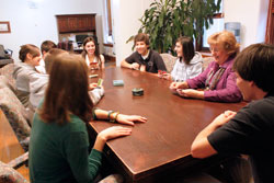 Franciscan Sister Therese Gillman enjoys a fun moment of playing cards with the students who are part of her &ldquo;Marathon Monday&rdquo; group, part of a program that connects students and staff members to come together to relax and talk about school, community and world issues. (Submitted photo)