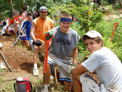 Volunteers from Our Lady of Providence Jr./Sr. High School in Clarksville take a break from digging a trench to bring clean&nbsp;running water to outlying villages in Nicaragua in the summer of 2012. From left, senior Lloyd Lashley, junior Abby&nbsp;Spitznagel, junior Megan Gilland, 2012 graduate Elliott Happel, Spanish teacher Alan Mathews, junior Trey Embry and junior Austin Happel. (Submitted photo)