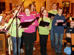 High school students from the New Albany Deanery sing in a youth choir prior to Archbishop Joseph W. Tobin&rsquo;s welcome Mass at St. Mary-of-the-Knobs Church in Floyd County on Jan. 29. Several choirs sang before and during the liturgy. (Photo by Patricia Happel Cornwell)