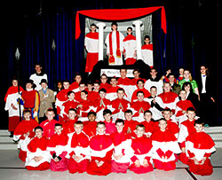 Students at St. Mary School in North Vernon pose on March 11 in their school&rsquo;s gym after completing a mock conclave in which students acted out various roles and, in the process, learned how popes are elected. Eighth-grader Bret Sawyer, center at the top, was elected pope on the second ballot and took the name Maximilian. (Submitted photo) 