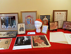 A collection of memorabilia from Cardinal Joseph E. Ritter&rsquo;s ministry in the Church is displayed in the renovated museum room of the Cardinal Ritter House in New Albany. The room was formerly the kitchen of the cardinal&rsquo;s family bakery. (Photo by Patricia Happel Cornwell)