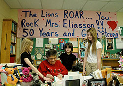 In her 50th year of teaching, Carmen Eliasson shares a fun teaching moment with three of her students at St. Mark School in Indianapolis&mdash;Maddie Man, left, Taylor Allen and Megan Pearsey. (Photo by John Shaughnessy)