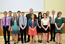 Archbishop Joseph W. Tobin and keynote speaker Liz Miskowiec pose with the A Promise to Keep high school mentors at St. Paul the Apostle Parish in Greencastle after the annual A Promise to Keep: God&rsquo;s Gift of Human Sexuality peer mentor luncheon at the Archbishop Edward T. O&rsquo;Meara Catholic Center in Indianapolis on April 11. (Photo by Natalie Hoefer)