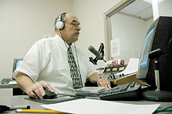 In this file photo, Jim Ganley, station manager of Catholic Radio Indy 89.1 and 90.9 FM, works in the station&rsquo;s production studio in Indianapolis. Catholic radio stations across central and southern Indiana continue to be an effective tool of evangelization. (File photo by Sean Gallagher)