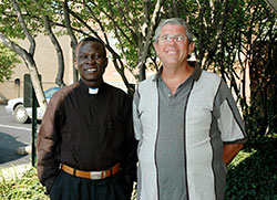 Sudanese Father Alfred Loro Caesar, left, and Comboni Father Michael Barton pose outside the Archbishop Edward T. O&rsquo;Meara Catholic Center in Indianapolis in this 2007 file photo. (File photo by Mary Ann Garber)