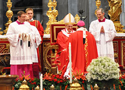 Pope Francis greets Archbishop Joseph W. Tobin of Indianapolis after presenting him with a pallium during Mass marking the feast of Sts. Peter and Paul in St. Peter&rsquo;s Basilica at the Vatican on June 29. The pope presented woolen palliums to 34 archbishops during the liturgy. (Photo by John Shaughnessy)
