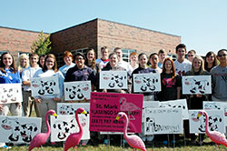Pink flamingos and cows have helped the youths of St. Mark and St. Roch parishes in Indianapolis raise money to attend the National Catholic Youth Conference in Indianapolis on Nov. 21-23. St. Mark teenagers placed flocks of flamingoes in people&rsquo;s yards as birthday greetings and good-natured pranks while St. Roch youths achieved the same effects with a herd of cows. (Photo by John Shaughnessy)