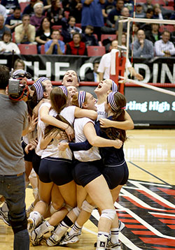 Our Lady of Providence Jr./Sr. High School players celebrate winning the Class 2A state volleyball championship on Nov. 9 at Ball State University&rsquo;s Worthen Arena in Muncie. (Submitted photo)