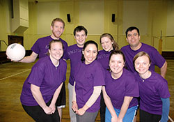 Sports set the stage for opportunities to embrace and deepen the faith of young adult Catholics in the archdiocese&rsquo;s recently started Young Adult Catholic Intramural Program. Members of the Unstop-Purples volleyball team pose for a team picture after a game on March 4. Players are, front row, Jennifer Peterson, left, Veronica Fuentes, Katie Sahm and Sarah Pluckebaum. Back row, Eric Burns, left, Dan Klee, Katie Klee and Jose Del Real. (Photo by John Shaughnessy)