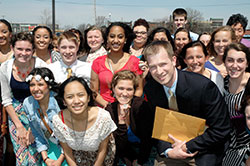 Matt Hollowell&rsquo;s focus on connecting the Catholic faith to the classes he teaches and the groups he leads is one of the reasons the math and physics teacher at Cardinal Ritter Jr./Sr. High School in Indianapolis was chosen as this year&rsquo;s Saint Theodora Gu&eacute;rin Excellence in Education Award recipient. Here he poses with one of the groups he leads&mdash;members of the school&rsquo;s A Promise to Keep group. (Photo by John Shaughnessy)