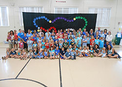 Youth participants and adult leaders of the vacation Bible School program &ldquo;Walking in the Light of Christ&rdquo; pose on June 29 at St. Paul School in New Alsace. Father Jonathan Meyer, pastor of All Saints Parish in Dearborn, which includes St. Paul School, helped develop the vacation Bible school program with the assistance of a team of youth ministers, teachers and other adult volunteers. (Submitted photo)