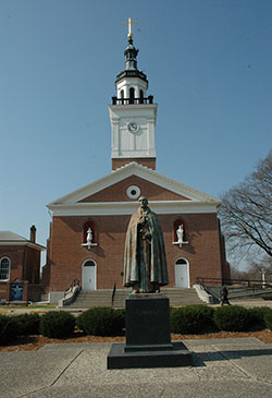 The Old Cathedral Basilica of St. Francis Xavier in Vincennes, Ind., is the oldest church in Indiana. Pilgrims from all over the world have visited the historic church. A statue of Father Pierre Gibault, vicar general of &ldquo;the Illinois country,&rdquo; who lived from 1737 to 1804, stands in front of the basilica. To mark the 180th anniversary of the founding of what is now known as the Archdiocese of Indianapolis, Archbishop Joseph W. Tobin will lead a one-day pilgrimage to Vincennes on Sept. 22.  (Criterion file photo)