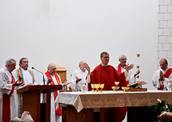Lafayette Bishop Timothy L. Doherty, center, was the principal celebrant and homilist at the opening Mass of the 50th anniversary celebration of the Central Indiana Cursillo Community on Aug. 9 at St. Susanna Church in Plainfield. Pictured at the altar, from left, are Deacon Frank Roberts, Father Glenn O&rsquo;Connor, Father Paul Graf, Father Marty Peter, Bishop Doherty, Father Keith Hosey and Deacon Michael Gray. (Photos by Patty Lamb)