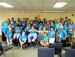 The SPRED retreat participants, catechists and helpers pose after the Mass that was held during the &ldquo;Hallelujah Luau&rdquo; retreat held at the Benedict Inn Retreat and Conference Center in Beech Grove on Aug. 2-3. (Submitted photo by Erin Jeffries)