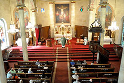 Archbishop Joseph W. Tobin delivers a homily to members of an archdiocesan pilgrimage during Mass at the Basilica of St. Francis Xavier&mdash;often called the &ldquo;Old Cathedral&rdquo;&mdash;in Vincennes, Ind., in the Evansville Diocese, on Sept. 22. An 1870 painted canvas depicts the crucifixion behind the high altar&mdash;built in 1904&mdash;in the nearly 200-year-old church that served what would later become the Archdiocese of Indianapolis. (Photo by Natalie Hoefer)