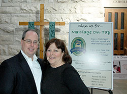 Steve and Therese Hartley stand in the narthex of St. Luke the Evangelist Church on Oct. 23. The couple is involved in the parish&rsquo;s Marriage on Tap program, which aims to strengthen marriages among Catholic couples. (Photo by John Shaughnessy)