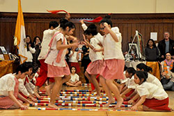 As part of the entertainment at the Intercultural Ministry Awards Dinner on Nov. 15 at the Archbishop Edward T. O&rsquo;Meara Catholic Center in Indianapolis, Filipino children perform a traditional Philippine &ldquo;tinikling&rdquo; dance, in which they step, hop and jump over and between moving bamboo sticks. (Photo by Natalie Hoefer)