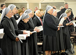 Seven of the nine Little Sisters of the Poor who operate the St. Augustine Home for the Aged in Indianapolis sing during the entrance hymn at a Nov. 14 Mass concelebrated by Archbishop Joseph W. Tobin prior to a fundraising dinner held on the sisters&rsquo; behalf. (Photo by Natalie Hoefer)