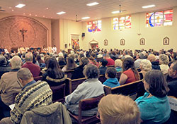 Members of the former St. Bernadette Parish in Indianapolis fill their faith community&rsquo;s church for Mass on Nov. 23. It was the final parish Mass in the church. Effective on Nov. 30, the parish was merged with nearby Our Lady of Lourdes Parish. The union of the two parishes came about as a result of the Connected in the Spirit planning process. (Submitted photo by Gary Yohler, St. Bernadette Class of 1959)