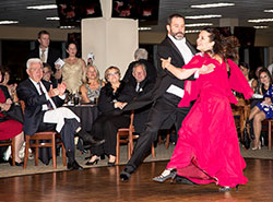 Father Aaron Pfaff and Salley Dooley dance a quickstep to Louis Prima&rsquo;s &ldquo;Sing Sing Sing&rdquo; during the Nov. 8 &ldquo;Dancing with the Shelby County Stars&rdquo; fundraising event at Indiana Grand Racing and Casino in Shelby County. Father Pfaff is pastor of St. Joseph Parish in Shelbyville and sacramental minister of St. Vincent de Paul Parish in Shelby County. The event benefitted two non-profit organizations&mdash;Shelby Senior Services Inc. and Shelby County Players. (Submitted photo by Warren Robison)